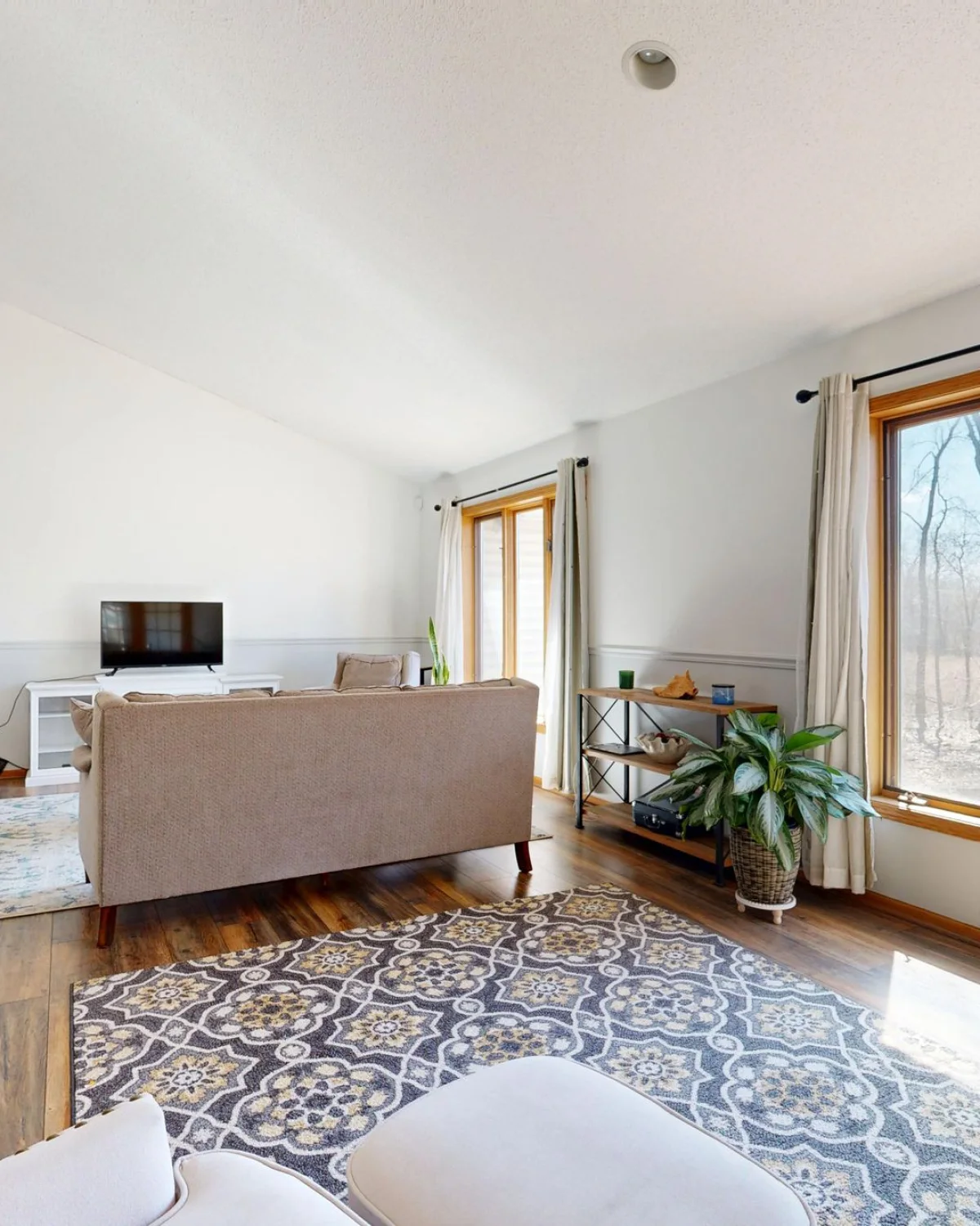 Bright furnished living room prepared before marketing a property for sale